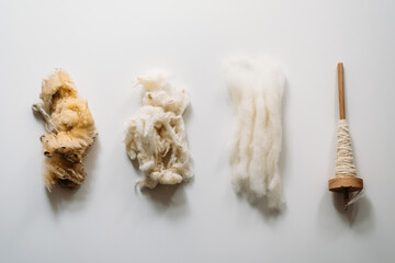Four stages: raw wool, washed wool, combed wool and yarn