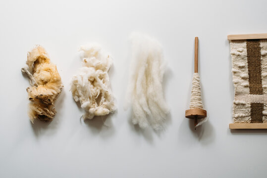 Five stages: raw wool, washed wool, combed wool, yarn and rug