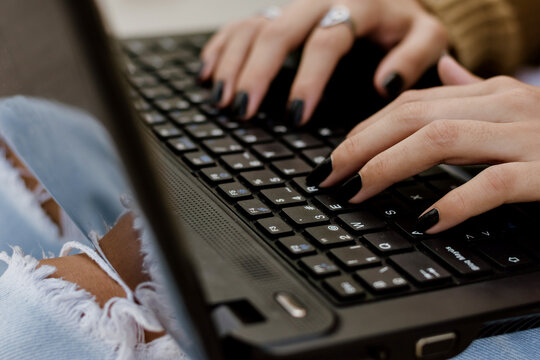 close-up of woman's hands on computer