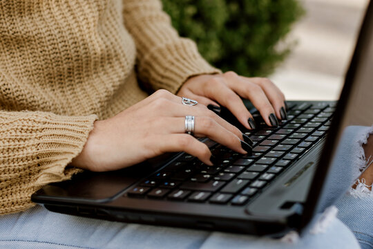close-up of woman's hands on computer