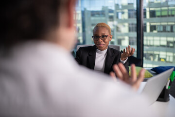 Black boss speaking with recruit