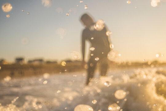 A surfer is hitting the waves
