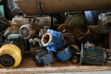 Old disassembled electric motor in a warehouse for repair.