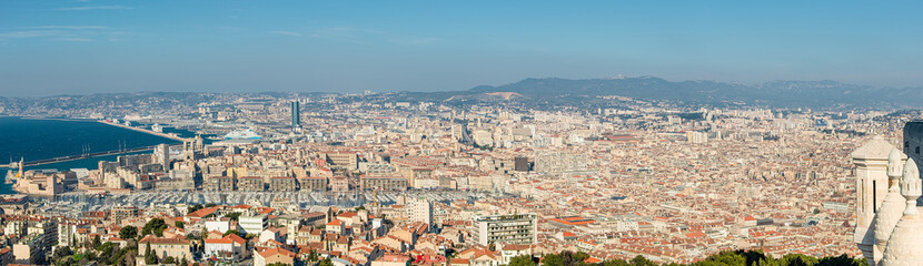 Fototapeta na wymiar Panoramic bird view over modern center, port and suburbs in Marseille at sundown France, sunny day, blue sky