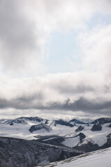 Fototapeta na wymiar Mountain top hiking nature winter snow cold sky horizon 