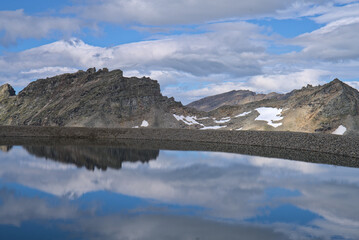 Hiking in Mölltaler Glacier area, high mountains, glacier, waterdams and cows on pastures 