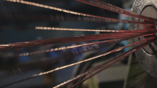 Mixering copper wire. Plant for the production of the cable. Close-up of a copper cable.