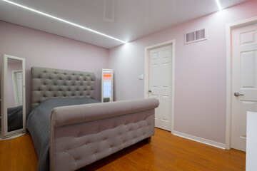 Modern master bedroom with screech celling and led light design	
