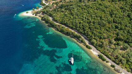 Fototapeta premium Aerial drone photo of paradise turquoise beach of Amoglossa meaning a sand tongue with crystal clear sea, Ionain, Greece