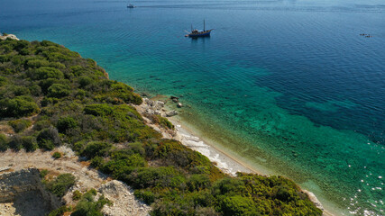 Aerial drone photo of exotic turquoise sandy beach forming a blue lagoon in tropical destination island bay