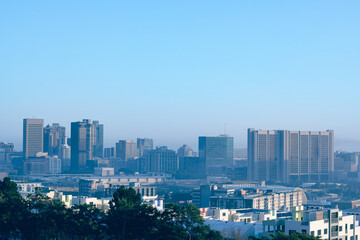 General view of cityscape with multiple modern buildings and skyscrapers in the morning