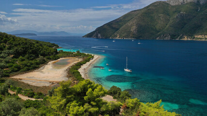 Aerial drone photo of paradise exotic azure beach of Agios Ioannis a famous yacht and sail boat visit in Ionian island of Meganisi, Greece
