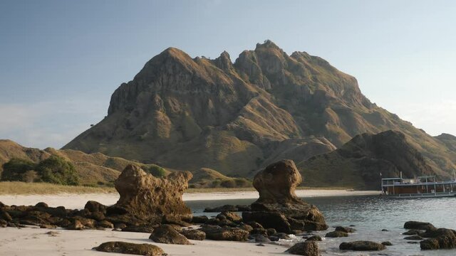 Beautiful mountain in Padar island in Komodo islands, Flores, Indonesia. Walking on the beach at Pulau Padar Island.