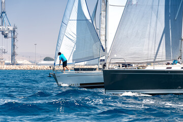 Sailing in the wind through the waves at the Mediterranean sea