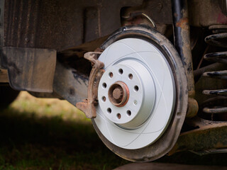 Close-up of a new brake disc on an old car