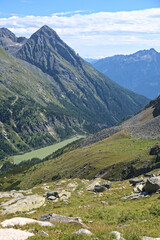 Fototapeta na wymiar Hiking in Mölltaler Glacier area, high mountains, glacier, waterdams and cows on pastures 