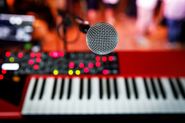 Microphone and keys during the concert. View from the stage.