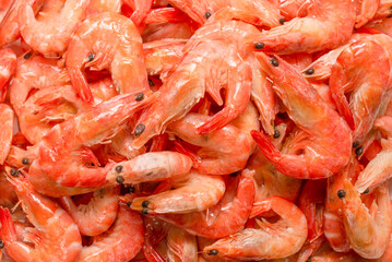 Shrimps background texture. A lot of shrimps. Cooked shrimps.