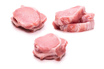 Raw pork pieces isolated on a white background.