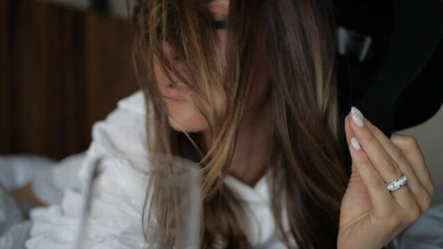 a beautiful girl with gray-doves eyes sexually posing for the camera, waving her hair. High quality FullHD footage