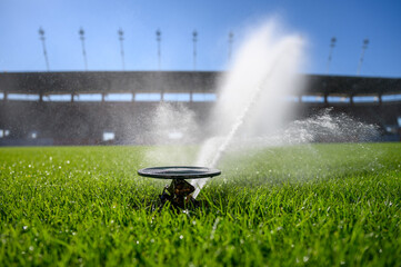 Watering grass on a football stadium © Dziurek