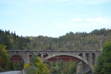 Fototapeta na wymiar bridge over the river in the mountains