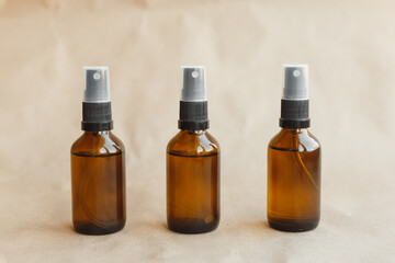 Set of amber bottles for essential oils and cosmetics. Glass bottle. Dropper, spray bottle