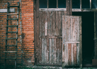  damaged brick vintage building facade with old elements 