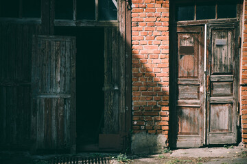  damaged brick vintage building facade with old elements 