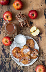 Sweet pancakes with apples, cinnamon and powdered sugar