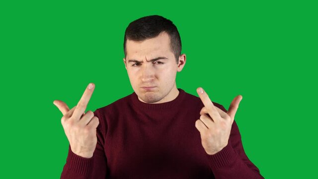 disgruntled man showing bad gesture with fingers on green screen