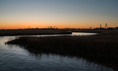 sunset over the marsh charleston bridge