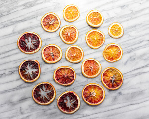 Dried Blood Oranges on White Marble