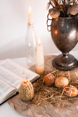 candles, painted eggs and bible. easter at home