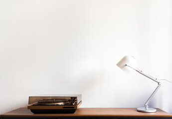 White lamp and an old turntable  with the white background