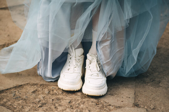 White Sneakers And Blue Ball Gown