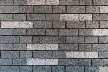brick wall texture in gray tones with some white bricks