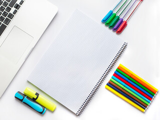 Note book on the table among colorful stationery