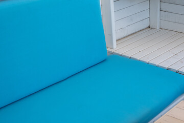 minimal white wooden blue sponge armchair, close up