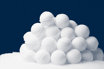 snowballs heap on dark blue background