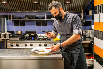 fabulous kitchen chef photographing his plate