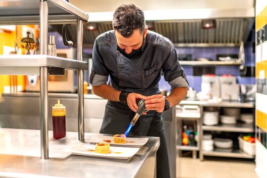 Fabulous Kitchen Chef Preparing His Dessert With Fire