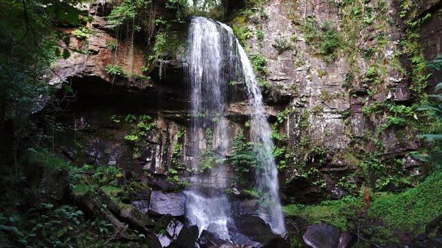 Melincourt Falls, Resolven, Vale of Neath, Port Talbot, South Wales, the United Kingdom. Beautiful Welsh waterfall. High quality 4k footage
