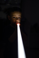 child boy playing with a led bar light