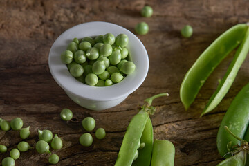 peas in bowl on wood