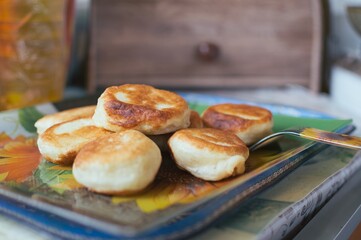 Fried yeast doughnuts on a platter