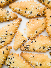 Rhombus cookies with black and white sesame flat lay pattern