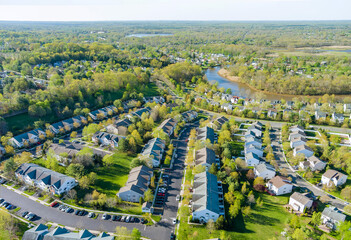 Fototapeta na wymiar Small american town district with houses and roads on aerial view