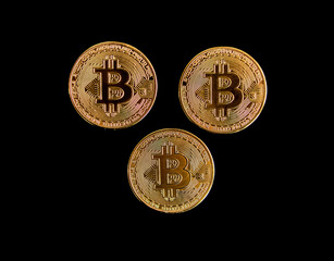 Bitcoin coins on a black background. Concept of power, economics, power, money, Btc, anonymity.