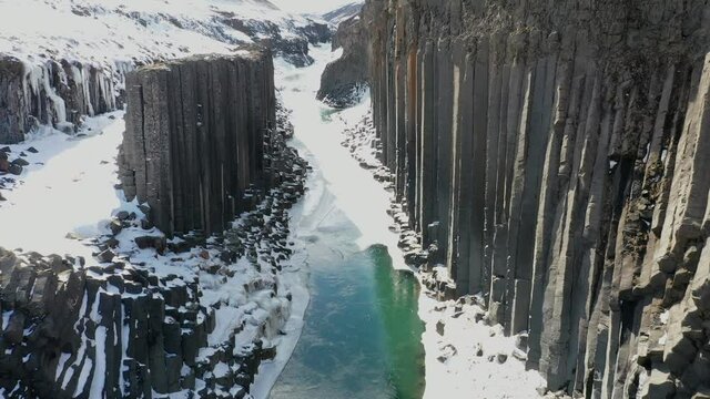 Stuðlagil basalt columns canyon from aerial view in 4k